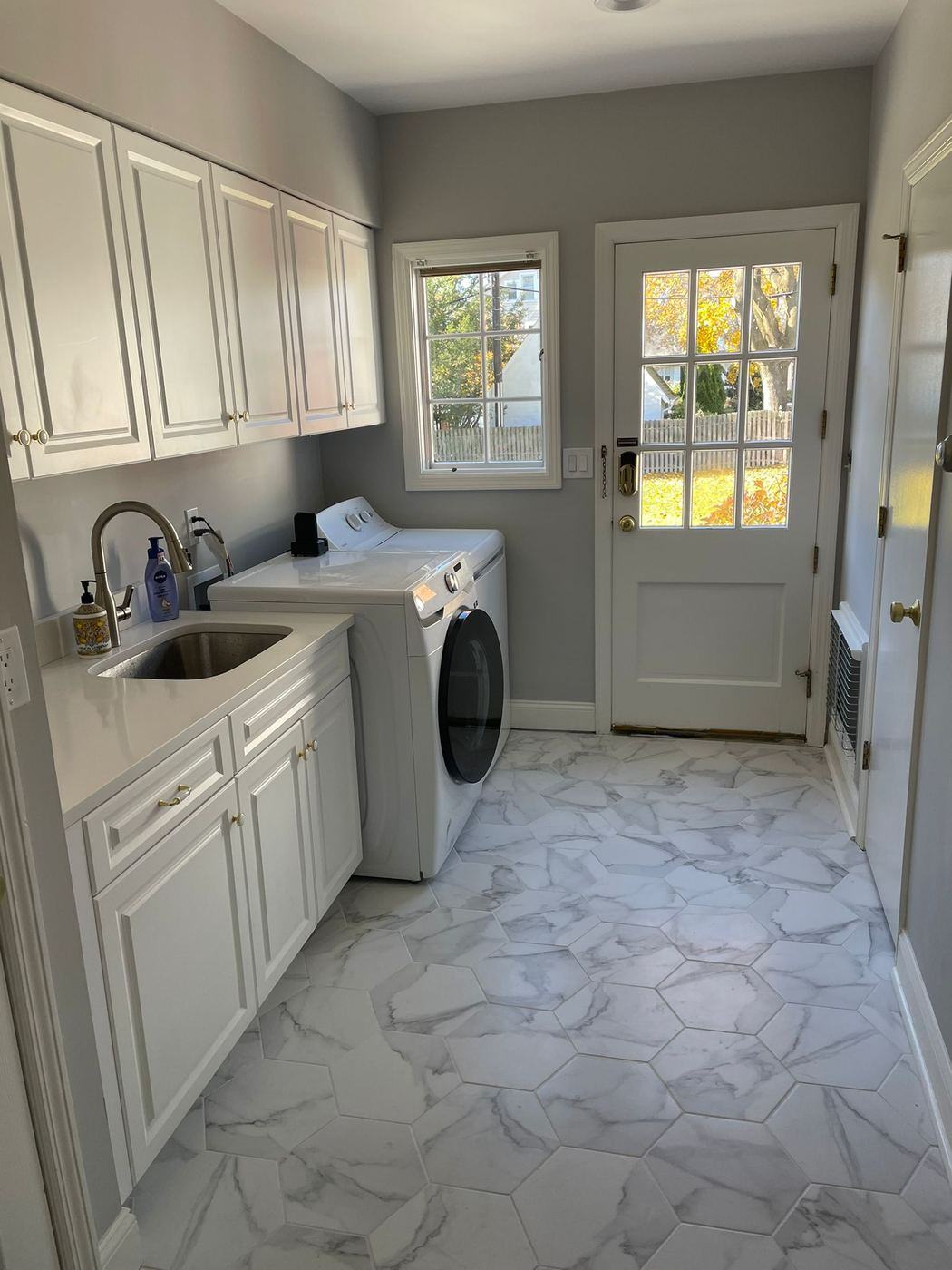 Laundry room remodel with marble tile